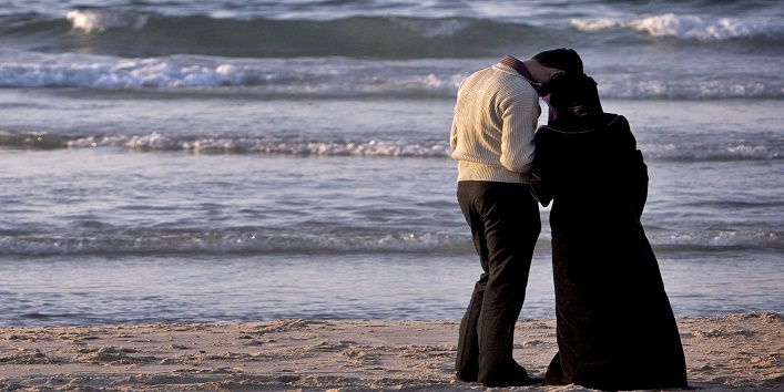 Palestinian couple on a beach