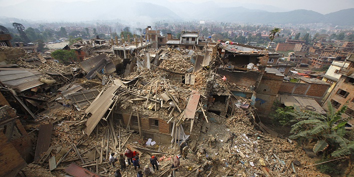 FILE – In this Sunday, April 26, 2015 file photo, rescue workers remove debris as they search for victims of an earthquake in Bhaktapur, Nepal. Nepal must take lessons from earthquake-hit countries such as Mexico and strictly enforce existing building laws as it prepares to rebuild from two major quakes, a senior United Nations official said Wednesday, May 20. Since the recent earthquakes, Nepalese authorities have been criticized for not enforcing building laws and allowing tall and weak buildings to be built. (AP Photo/Niranjan Shrestha, File)