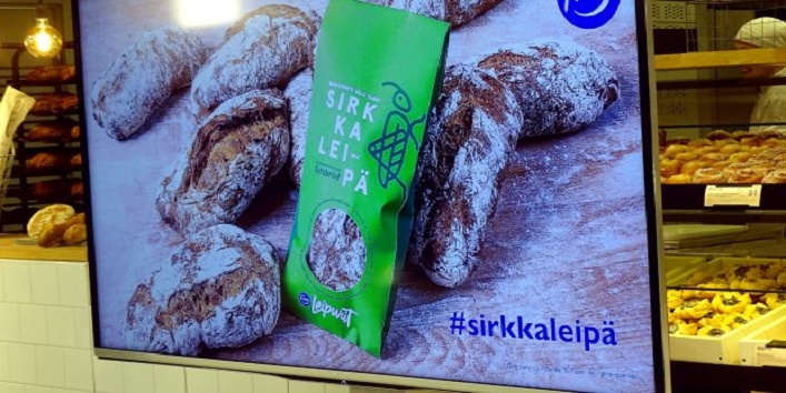A poster with the Finnish food company Fazer's first mass-delivered bread made of insects is seen in the bakery in Helsinki
