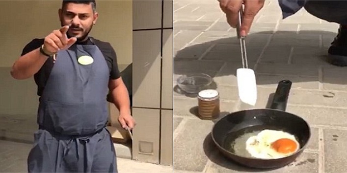 man fries eggs on the street to show the hot weather cover
